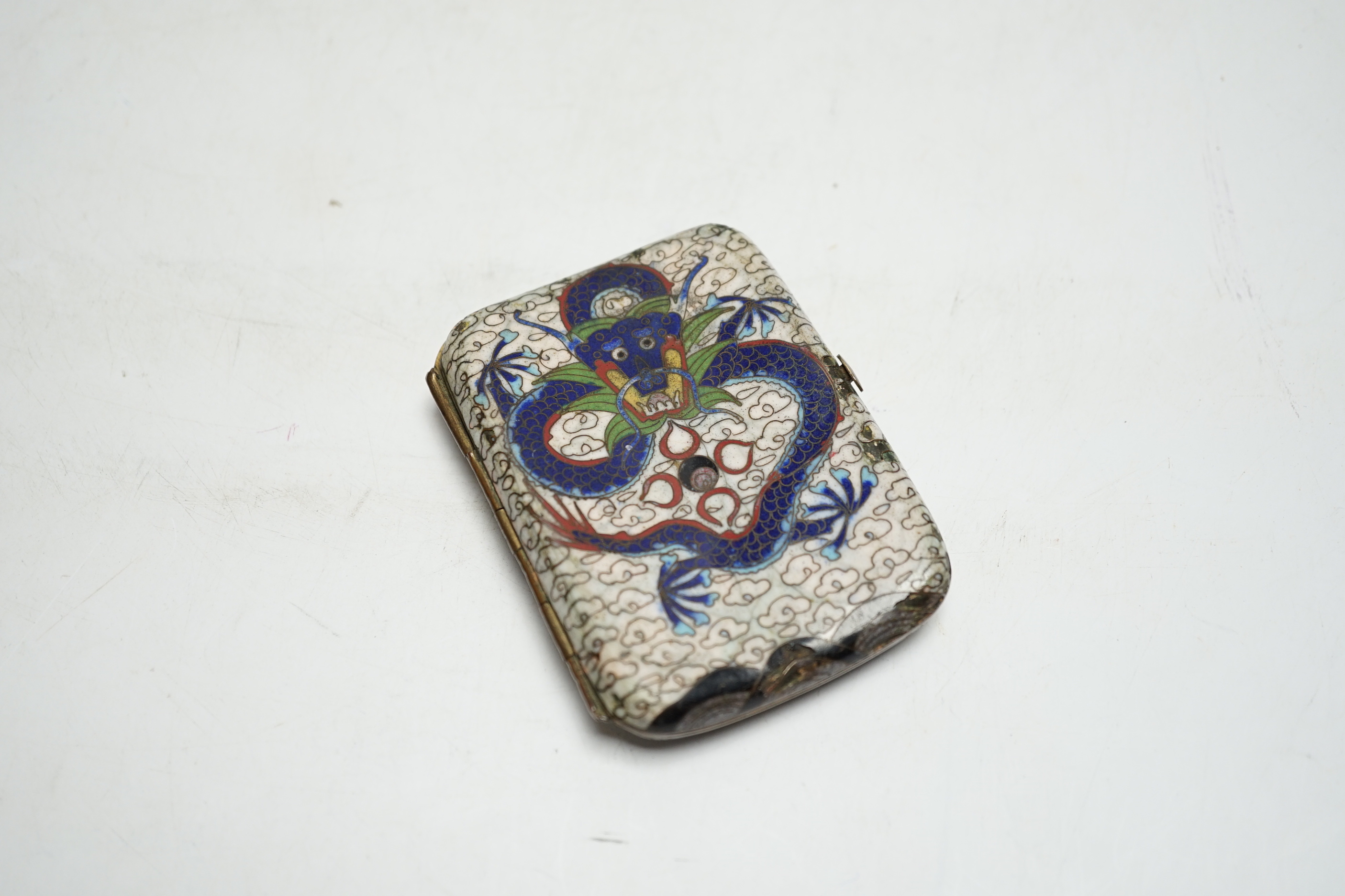 A Chinese cloisonné enamel ‘dragon’ design cigarette case, 9cm wide x 7cm deep